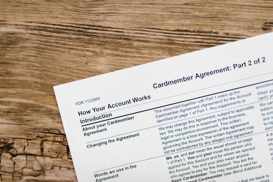 A multi-page printed financial agreement document with small print