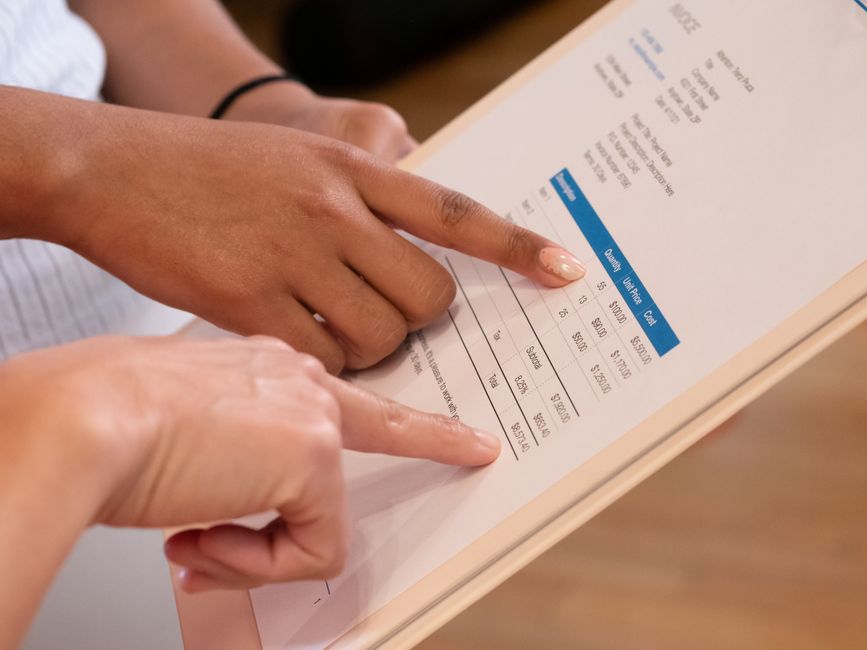 Close-up of a printed billing statement showing rows of charges