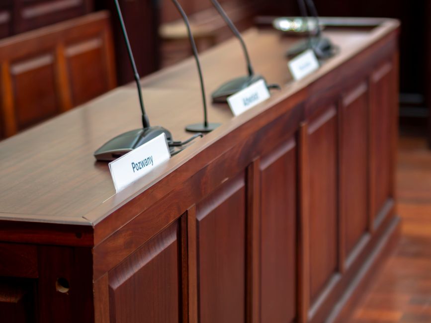 Panel of officials seated at a dais during a public government hearing