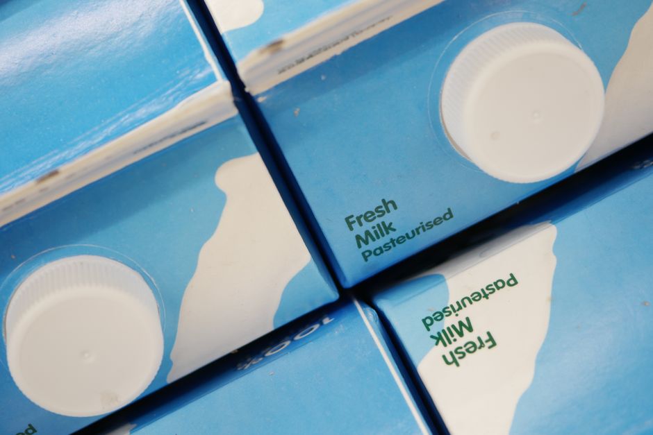 Close-up of a printed date stamp on the top of a milk carton