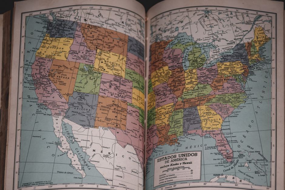 A paper map of the United States spread out on a flat surface