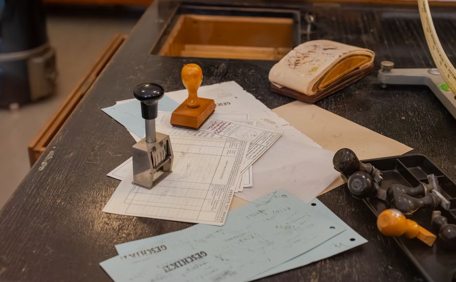 Rubber stamp pressed onto a paper document on a desk